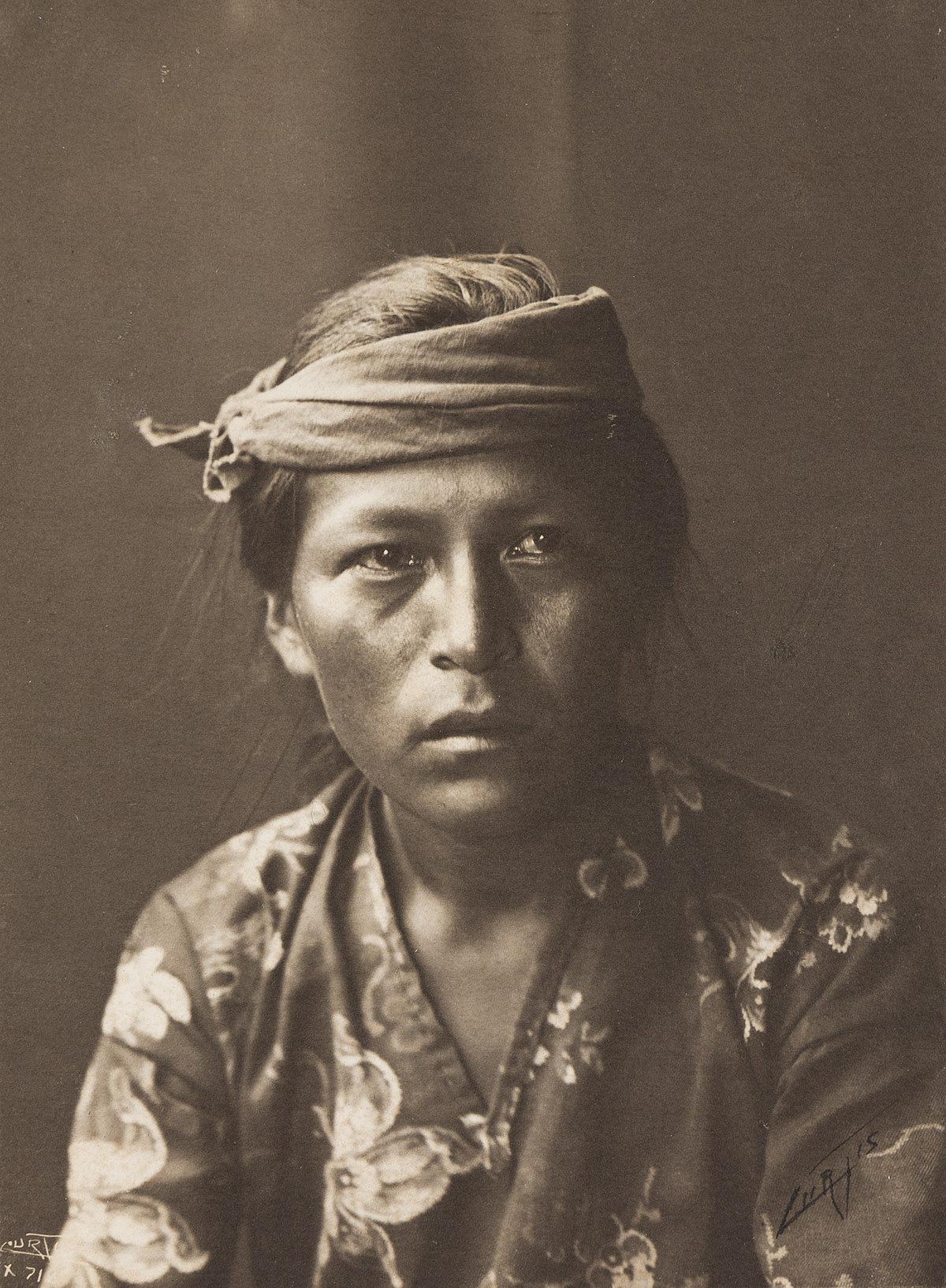 EDWARD S. CURTIS (1868-1952) Portrait of a young figure.